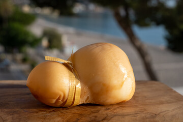 Italian semi hard handmade smoked scamorza cheese, from cow milk from Apulia or Calabria regions...