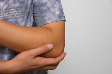 Close-up of elbow pain—ideal for medical ads on joint disorders, gout, tendon strain, and nerve...