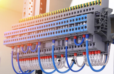 Electrical terminals with connected insulated copper wires with metal lugs. Marking with a thermal printer. 