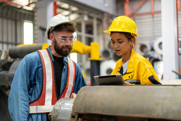 female engineer supervisor advice technician foreman to inspect and check spare part equipment of...