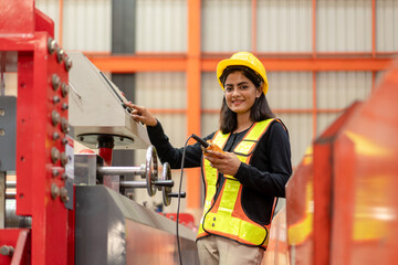 woman engineer worker check and control material planning to inspect and repair equipment in...
