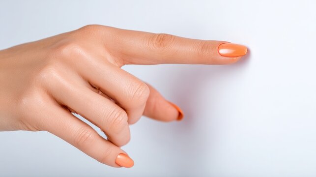 Gesture of Guidance: A close-up shot captures a manicured hand gracefully pointing, conveying direction or emphasis in a clean, modern style.