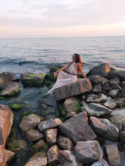 woman sitting on a rock