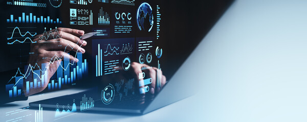 Businessman analyzing futuristic digital data dashboard with charts and graphs.