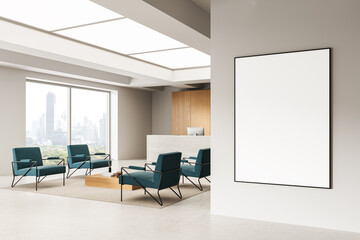 Modern office interior with blank poster mockup on wall and seating area with city view and...