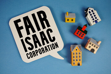 FICO Fair Isaac Corporation text with house models on blue background