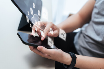 Close-up of hands managing files on a smartphone, floating cloud and documents symbolize cloud...