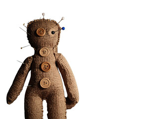Burlap voodoo doll with pins and button eyes against a dark background, evoking themes of magic and...