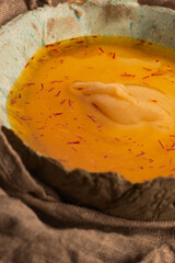 Traditional Polish Sour Rye Soup with Saffron in Ceramic Bowl