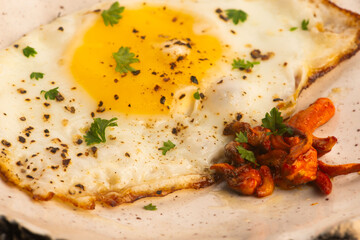 Fried Cordyceps Mushrooms with Sunny Side Up Egg on Handmade Ceramic Plate