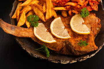 Breaded flounder with fries and kimchi