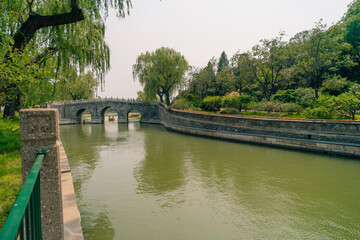 Fototapeta premium Beijing, China - june 2 2025 China traditional tourist boats on Beijing canals of Qianhai lake at ShiChaHai district