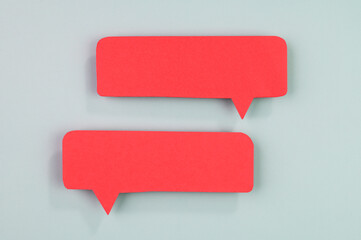 Red speech bubbles on blue background.