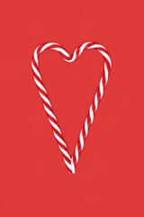 Candy cane heart shape abstract decoration romantic design. Festive decorative symbol for Yule, Noel, Xmas. Abstract minimal logo. Gift tag, greeting card.