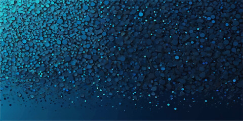 Blue drops of liquid form a winter rain pattern on glass, illuminated by a cold light