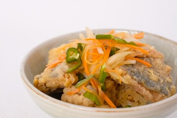Nanbanzuke , Fried horse mackerel marinated in sweet and spicy vinegar. 
