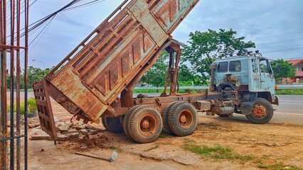 Dump Truck Unloading Gravel on Road