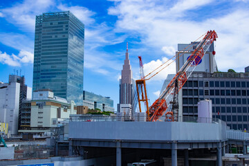 Fototapeta premium A cityscape of crane at the under construction in the business town