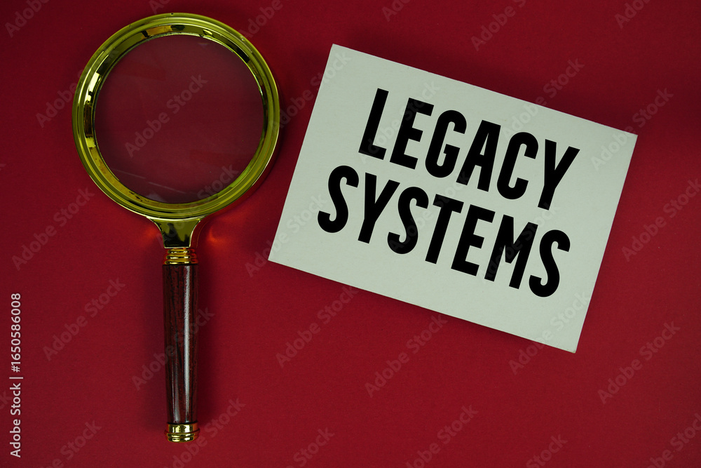 Poster legacy systems text written on paper with magnifying glass