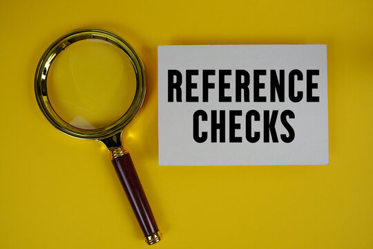 Reference Checks text written on paper with magnifying glass