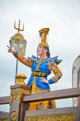 Mongolian girls dressed in luxurious Mongolian costumes on the Mongolian war chariots of the Jinyuan Grand Tent on the grassland
