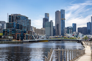 A view of the Yarra River and city architecture of Melbourne, Australia, with the Seafarers Bridge...