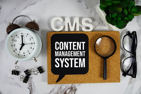 CMS - Content Management System acronym with alarm clock and magnifying glass, business concept background