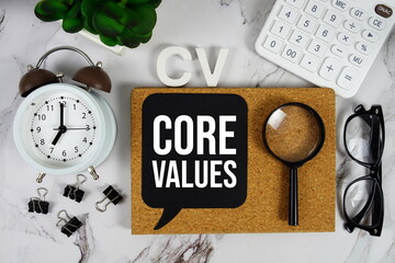 CV - Core Values acronym with calculator, alarm clock and magnifying glass, business concept...