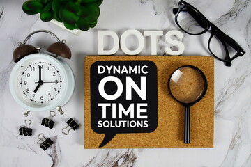 DOTS - Dynamic On Time Solutions acronym with alarm clock and magnifying glass, business concept...