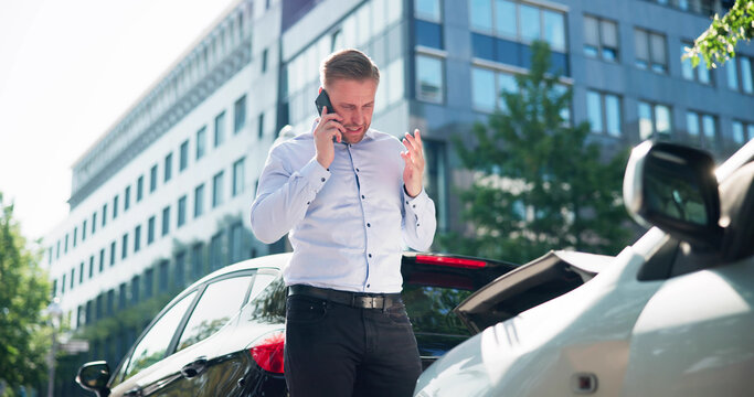 Man Calling For Assistance With Broken Car Engine After Accident - Powered by Adobe