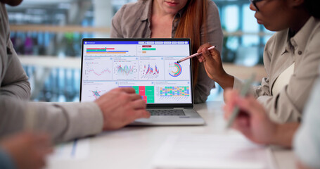Diverse Team Of Analysts Collaborate