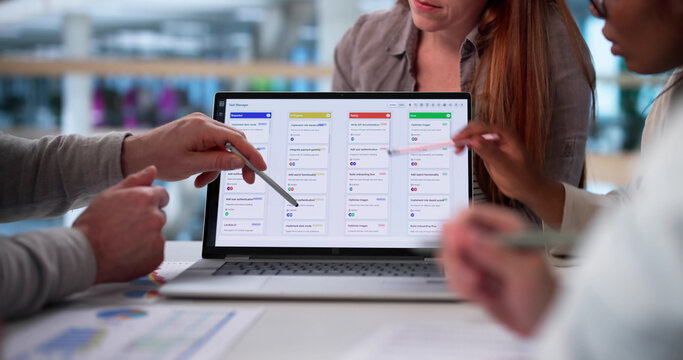 Diverse Group Of Young Professionals Collaborating On Software - Powered by Adobe