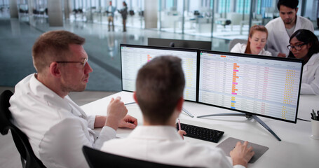 Hospital Doctors Analyzing Billing Codes Online