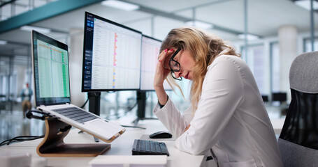 The Frustrated Nurse Is Using The Computer To Study Patient Data