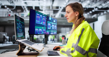 Fototapeta premium Female Engineer Operates SCADA System