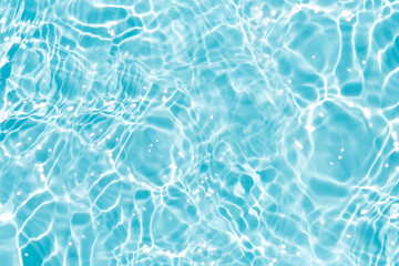 Blue water with ripples on the surface. Defocus blurred transparent blue colored clear calm water...