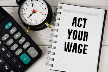 Act Your Wage text with calculator and alarm clock on wooden background