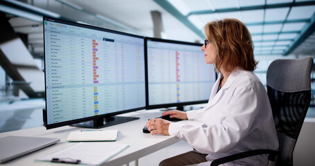 Senior Nurse Using Clinical Coding On Computer