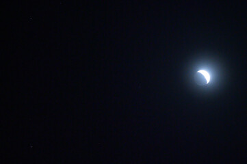 The Moon is in its waxing crescent phase and is visible in the night sky near Jupiter and the twin...