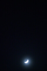 The Moon is in its waxing crescent phase and is visible in the night sky near Jupiter and the twin...