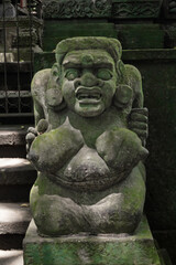 Balinese Ancient Stone Statues and Mythological Sculptures. Traditional Carvings of Frogs, Dragons, Devils, Deities and Guardians at Sacred Monkey Forest Sanctuary Ubud Bali Indonesia.