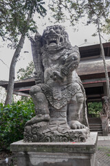 Balinese Ancient Stone Statues and Mythological Sculptures. Traditional Carvings of Frogs, Dragons, Devils, Deities and Guardians at Sacred Monkey Forest Sanctuary Ubud Bali Indonesia.