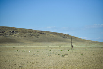 Barren Landscape with Gentle Hill and Clear Sky