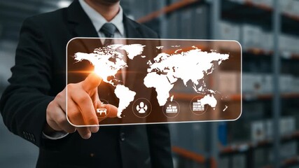 Businessman interacts with digital world map in warehouse - Powered by Adobe