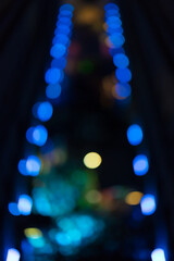 Abstract defocused bokeh lights in blue and multicolor creating futuristic night background