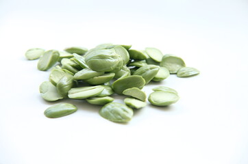 A collection of fresh, peeled petai seeds, a popular ingredient in spicy Indonesian cuisine and a...