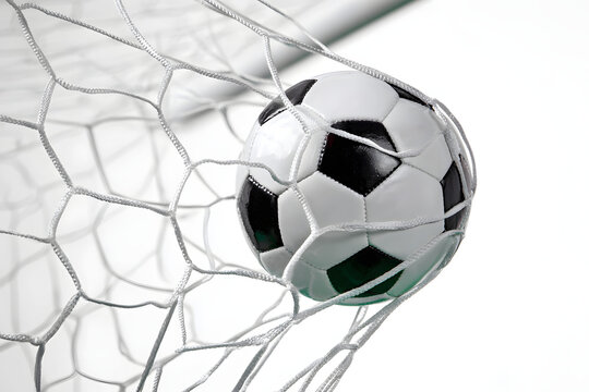 An action-packed image of a soccer ball entering the goal net, with the netting stretching as the ball hits, creating a dramatic effect.