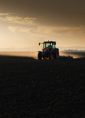 Tractor preparing the land for a new crop planting