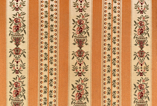 Vintage golden Biedermeier striped furniture fabric. Vintage Biedermeier upholstery fabric. Top view.