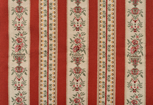 Vintage red Biedermeier striped furniture fabric. Vintage Biedermeier upholstery fabric. Top view.